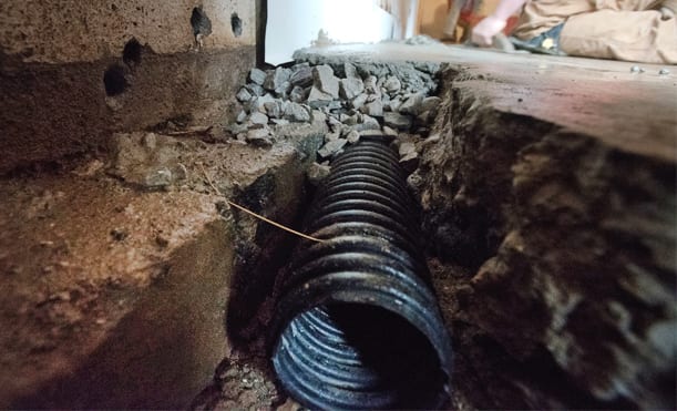 Installing French Drains in a Basement - D-Bug Waterproofing