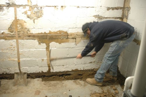 D-Bug Waterproofing digging french drain trench