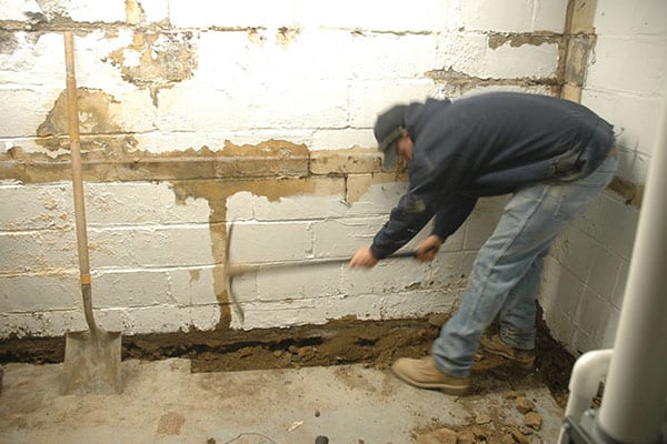 D-Bug Waterproofing digging trench for french drain