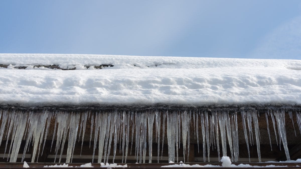 Ice dams on gutter of home